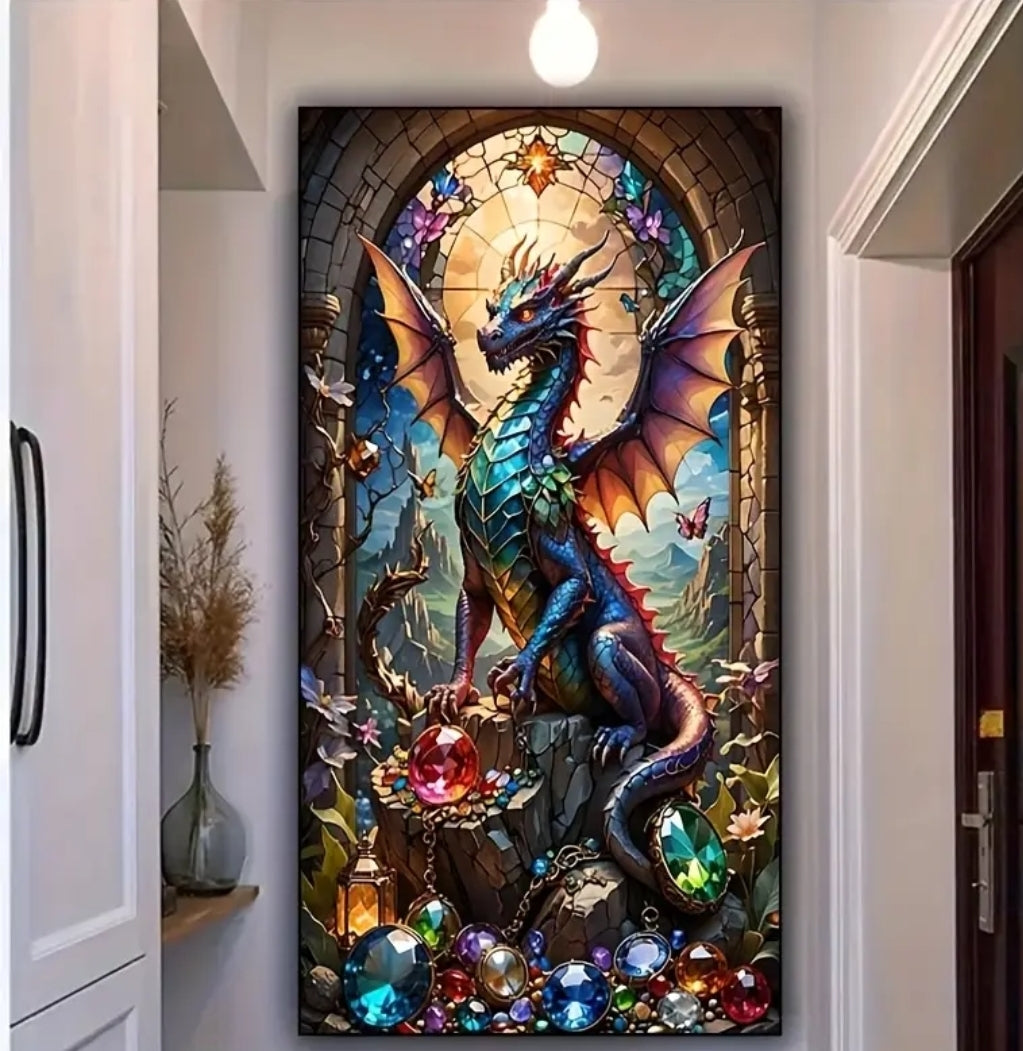 Framed in a tin black frame this exclusive diamond painting adorns the wall of a home displaying A majestic and brightly colored dragon sits in a doorway of an ancient castle on top of a dazzling display of precious bright shining gems and crystals. The dragon proudly spreads its wings towards the sky and stands out against a mountainous background that can be seen through the arched doorway.