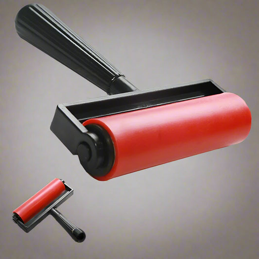 Red ergonomic roller for diamond painting . The roller flattens diamond beads securely into place, making your artwork neater, firmer, and more polished.