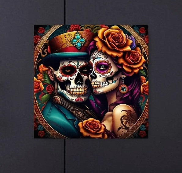 Two lovers pose cheek to cheek, their faces lavishly painted like the decorative skulls of the Day of the Dead. The woman wears large orange roses in her long mauve colored hair and the man wears a festive aqua and orange hat. Bone stare seductively into the camera and their mysterious smiles give off an air of passion and playfulness. 